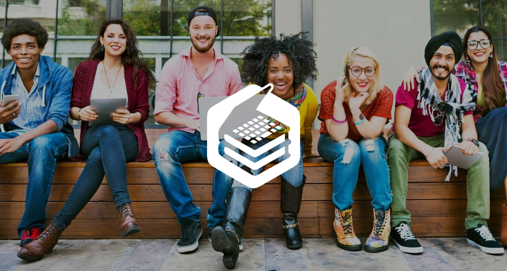 Group of students sitting on a wall