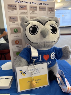 stuffed owl wearing I heart oer shirt with a yellow ZTC conference badge.