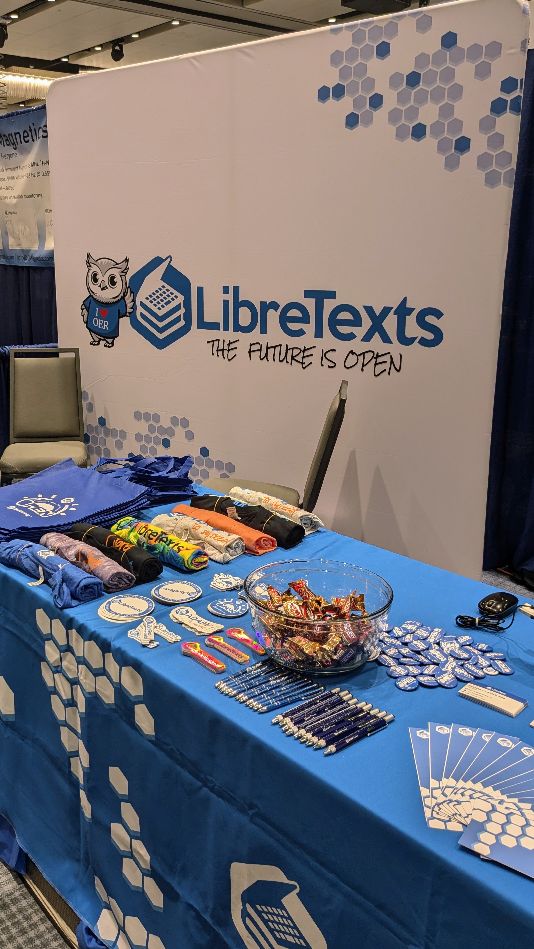 booth in conference for libretexts with swag